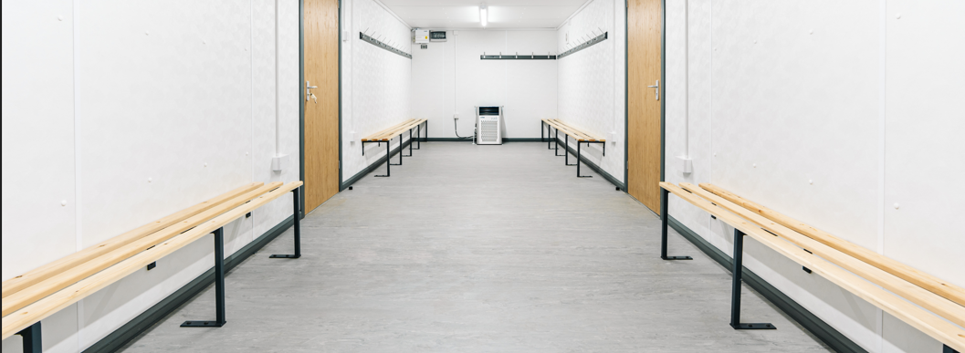 interior of a drying room with brown wooden boards